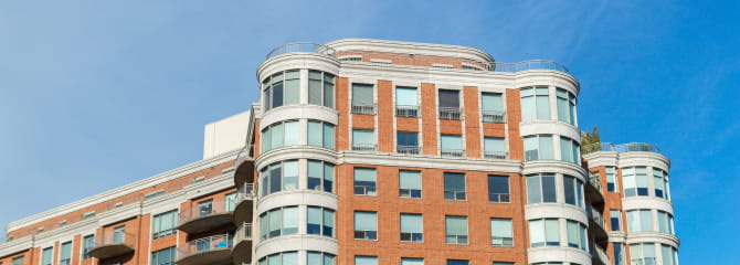 The exterior of a large modern condo building