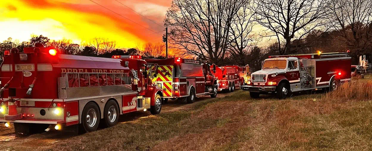 Fire trucks at sunset