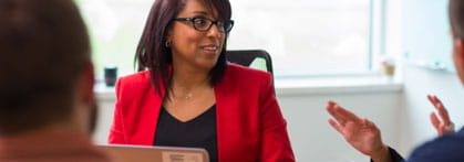 Lady with laptop in a meeting