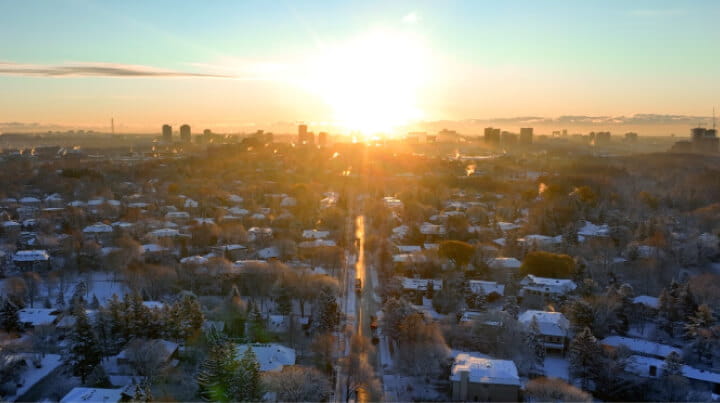 Aerial view of an urban neighborhood at sunset.