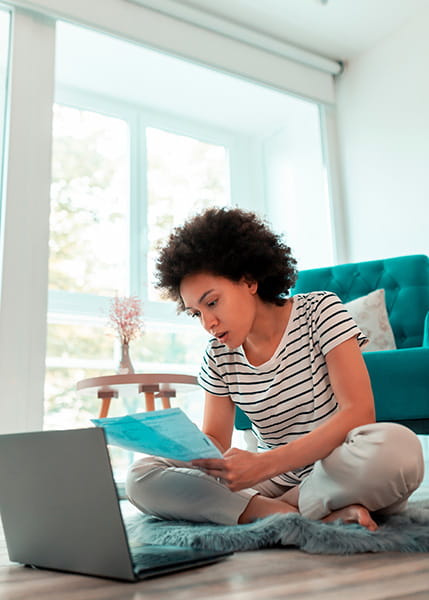 Woman paying household bills online