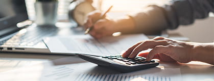 A person using a calculator