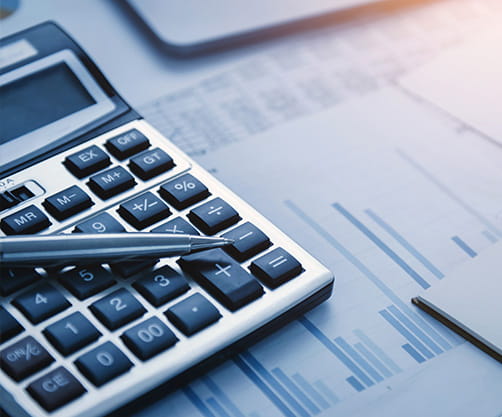 Calculator and a pen on the table