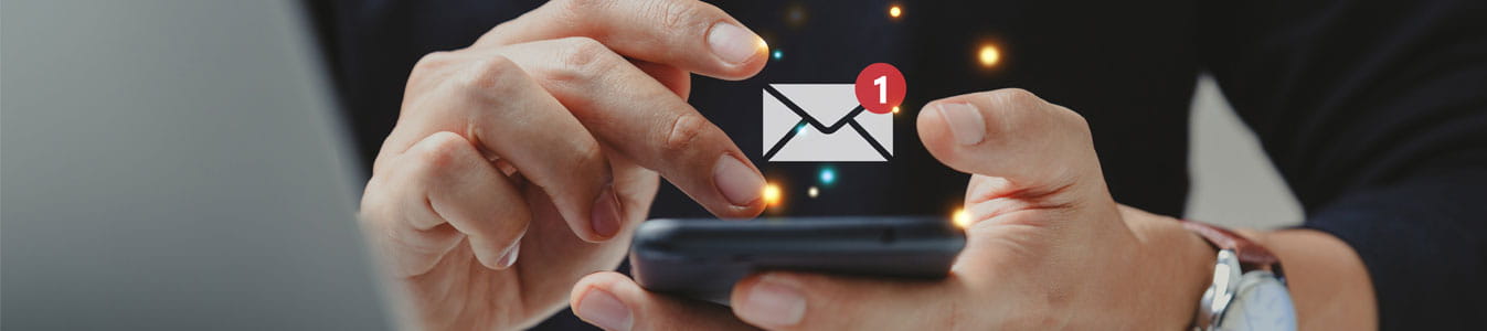 Hand of person using smartphone for email with notification alert