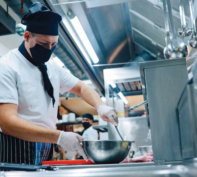 Chef in a kitchen, preparing food