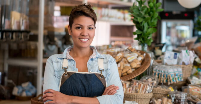 Woman working at a grocery store.