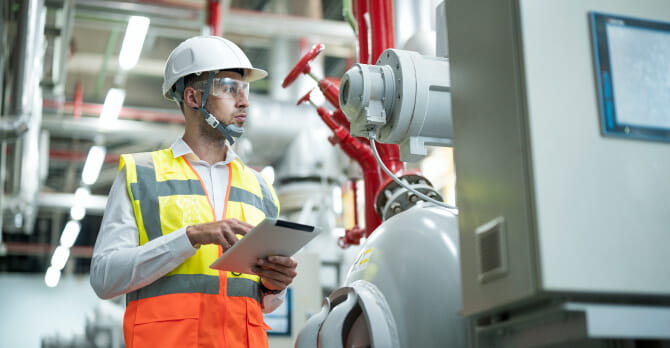 Engineer inspecting heating supply