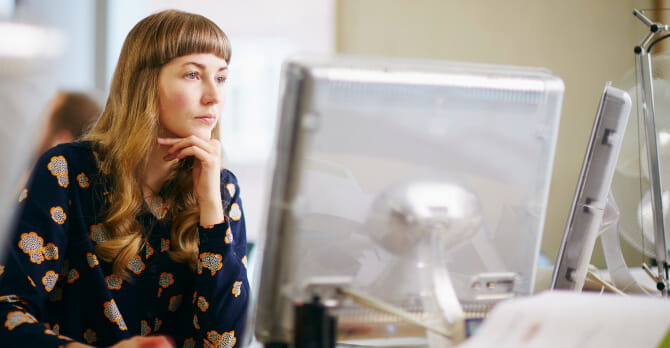 Woman looking at computer screen.