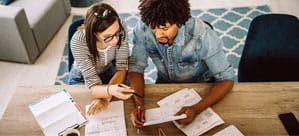 Couple reading their bills