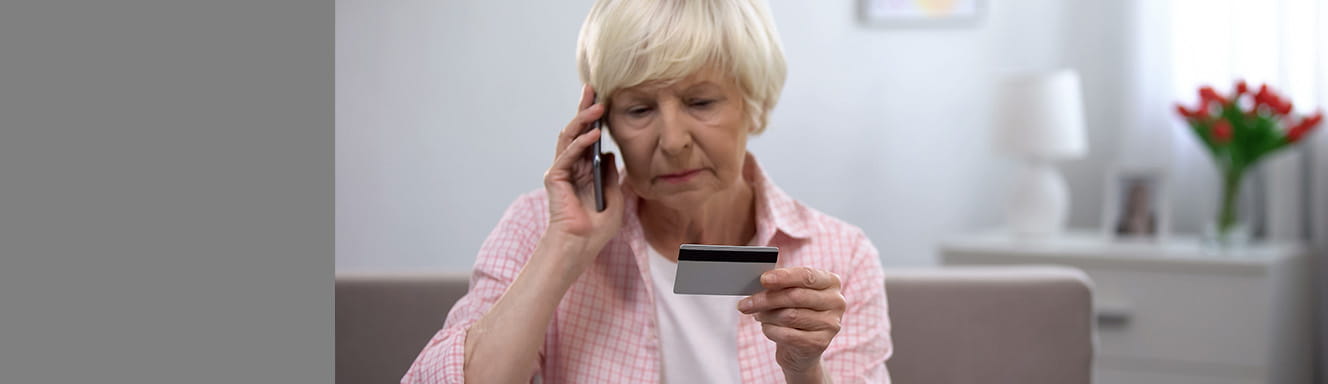A woman with credit card calling service hotline