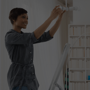 Woman putting a bulb in