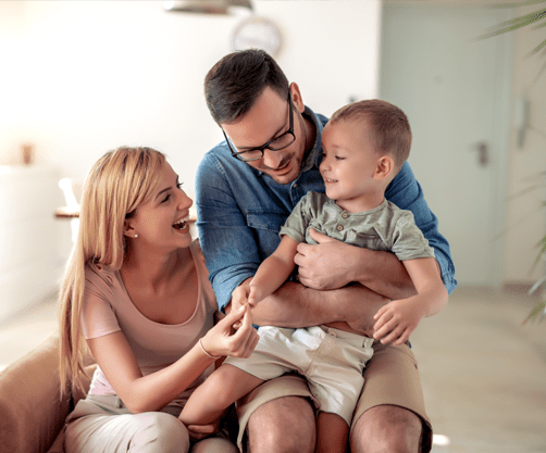 Mother, father and child in their home